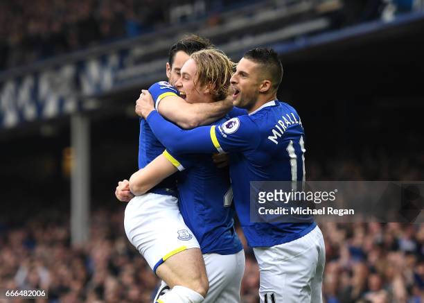 Tom Davies of Everton celebrates scoring the opening goal with Kevin Mirallas during the Premier League match between Everton and Leicester City at...