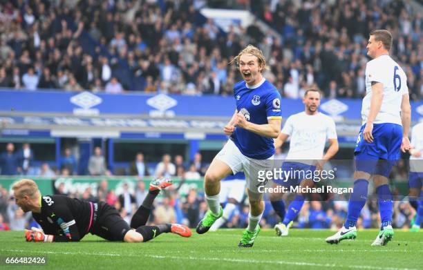 Tom Davies of Everton celebrates scoring the opening goal during the Premier League match between Everton and Leicester City at Goodison Park on...