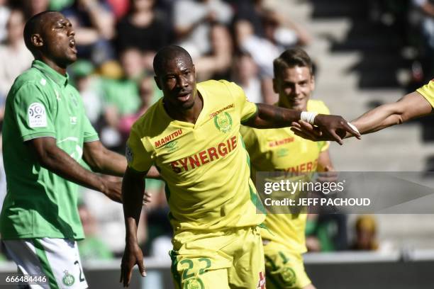 Nante's Burkinabese forward Prejuce Nakoulma celebrates and reacts after scoring a goal during the French L1 football match between AS Saint-Etienne...