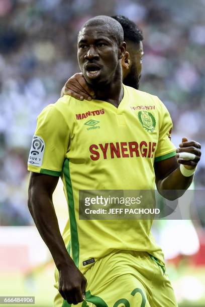 Nante's Burkinabese forward Prejuce Nakoulma celebrates and reacts after scoring a goal during the French L1 football match between AS Saint-Etienne...