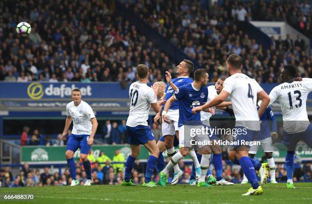 Phil Jagielka of Everton scores his team's third goal during the Premier League match between Everton and Leicester City at Goodison Park on April 9,...