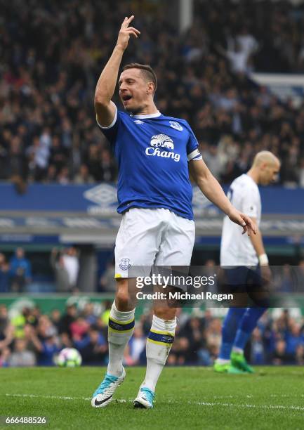 Phil Jagielka of Everton celebrates scoring his team's third goal during the Premier League match between Everton and Leicester City at Goodison Park...