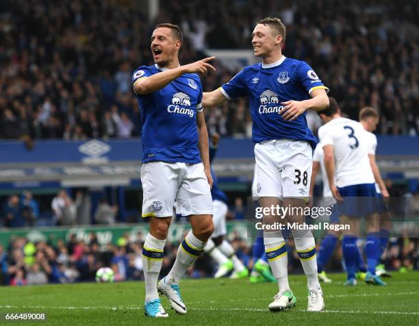 Phil Jagielka of Everton celebrates scoring his team's third goal with Matthew Pennington during the Premier League match between Everton and...