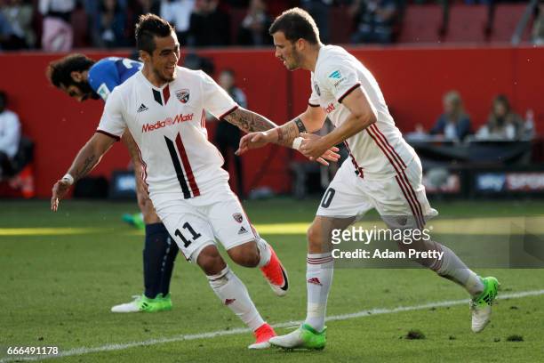 Pascal Gross of Ingolstadt celebrates his team's first goal with team mate Dario Lezcano during the Bundesliga match between FC Ingolstadt 04 and SV...