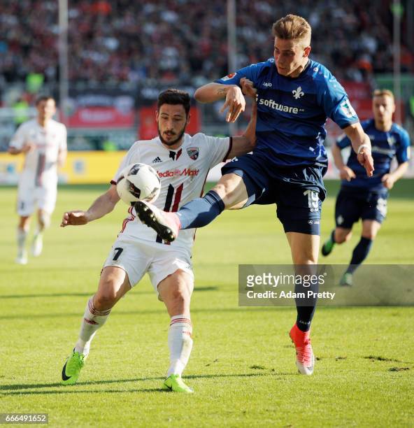 Felix Platte of Darmstadt is challenged by Mathew Leckie of Ingolstadt during the Bundesliga match between FC Ingolstadt 04 and SV Darmstadt 98 at...