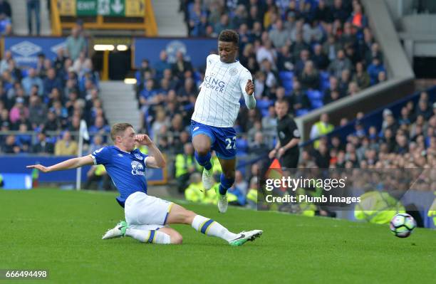 Demarai Gray of Leicester City in action with Matthew Pennington of Everton during the Premier League match between Everton and Leicester City at...