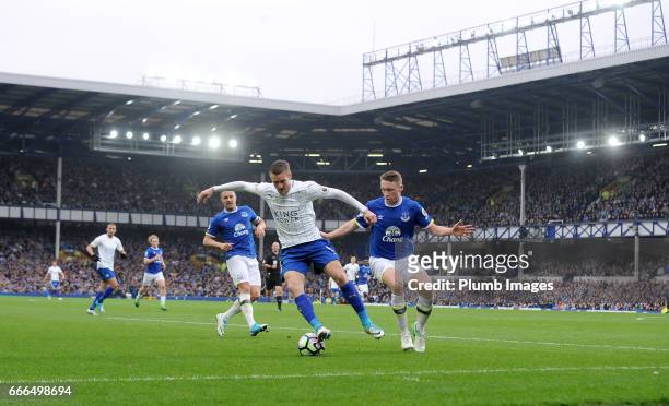 Jamie Vardy of Leicester City in action with Matthew Pennington of Everton during the Premier League match between Everton and Leicester City at...