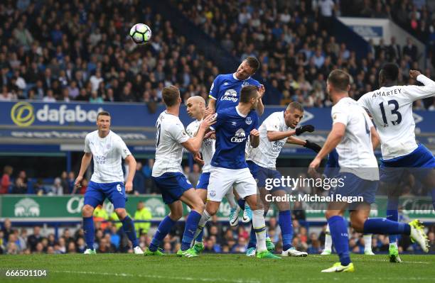 Phil Jagielka of Everton scores his team's third goal during the Premier League match between Everton and Leicester City at Goodison Park on April 9,...