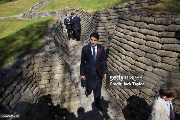 Canadian Prime Minister Justin Trudeau and his son Xavier James Trudeau, age 9 , tour the preserved trenches at Vimy Memorial Park on April 9, 2017...