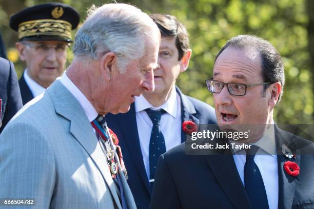 French President Francois Hollande speaks with Prince Charles, Prince of Wales following a tour of the preserved trenches at Vimy Memorial Park on...