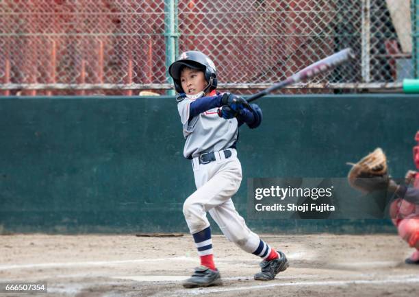 youth baseball players,playing game,batting - battere la palla foto e immagini stock