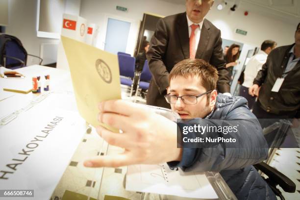 Man is seen placing his vote at the Turkish embassy in Warsaw, Poland on 9 April, 2017. A week ahead of the referendum in Turkey people are allowed...