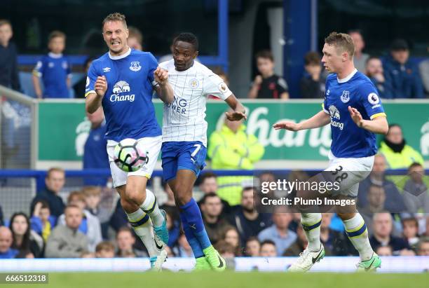 Ahmed Musa of Leicester City in action with Phil Jagielka and Matthew Pennington of Everton during the Premier League match between Everton and...