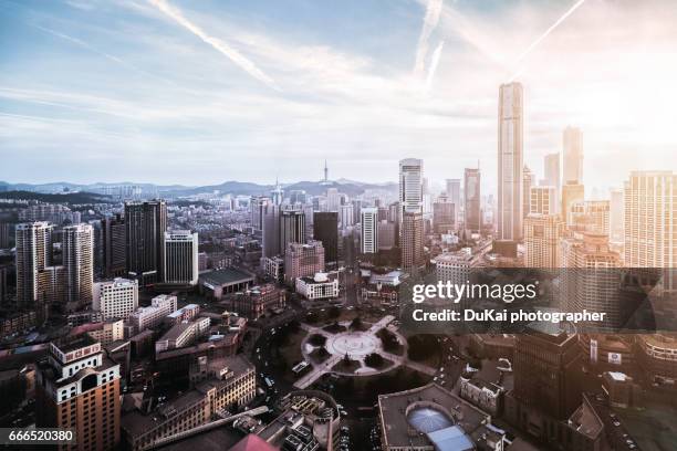 dalian zhongshan square sunset - dalian stock pictures, royalty-free photos & images