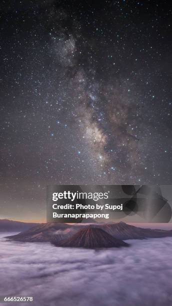 dreamlike milky way and mountain range before morning sunrise at bromo volcano mountain with vertical 16:9 format , east java , indonesia - 169 format stock-fotos und bilder
