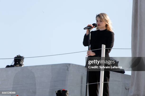 Canadian singer Coeur de Pirate performs on stage during the official ceremony for the Commemoration of the 100th Anniversary of Vimy Battle on April...