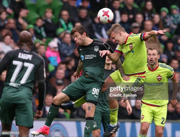 Fyodor Smolov of FC Krasnodar is challenged by Pontus Wernbloom of FC CSKA Moscow during the Russian Premier League match between FC Krasnodar v FC...