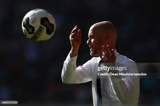 Manager / Head Coach of FC Utrecht, Erik ten Hag throws the ball to a player during the Dutch Eredivisie match between FC Utrecht and FC Twente at...