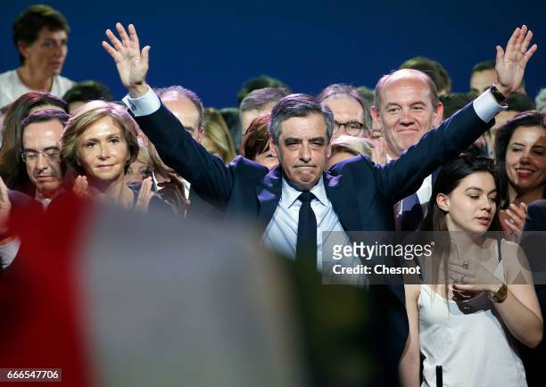 Former French Prime Minister and French presidential elections candidate for the right-wing "Les Republicains" political party Francois Fillon waves...
