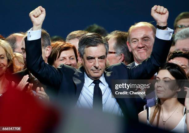 Former French Prime Minister and French presidential elections candidate for the right-wing "Les Republicains" political party Francois Fillon waves...