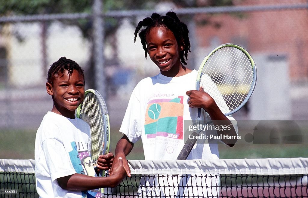 Tennis players Venus and Serena Williams practice in 1991 in Compton