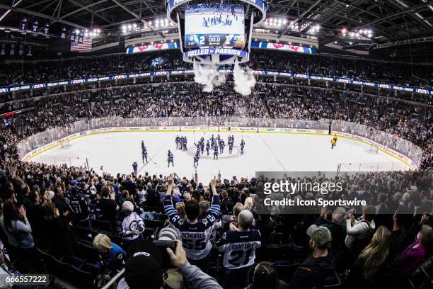 April 08: Jets fans celebrate their team during the NHL game between the Winnipeg Jets and the Nashville Predators on April 08, 2017 at the MTS...