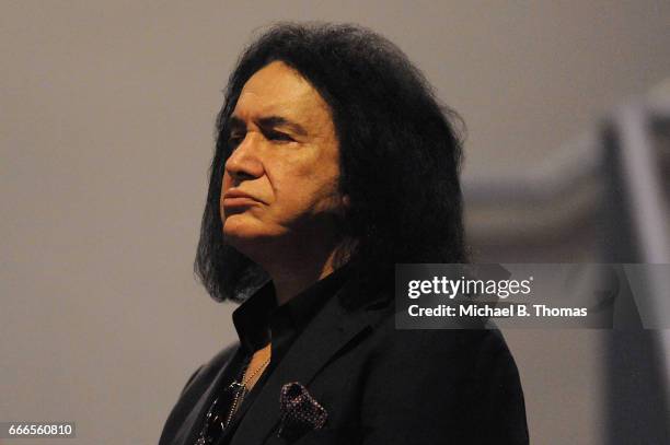 Gene Simmons, co-founder of the rock band, KISS, looks on during the memorial service for Rock-n-Roll legend Chuck Berry at the Pageant Concert Hall...