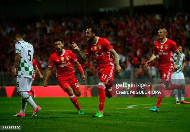 Benfica's Greek forward Konstantinos Mitroglou celebrates after scoring a goal during the Portuguese league football match Moreirense FC vs SL...