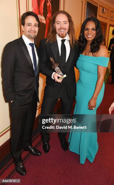 Lin-Manuel Miranda, Tim Minchin, accepting the Best New Musical award for "Groundhog Day", and Audra McDonald pose in the winners room at The Olivier...