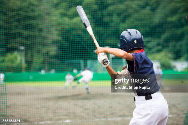 youth baseball players,playing game,batting - batting sports activity ストックフォトと画像