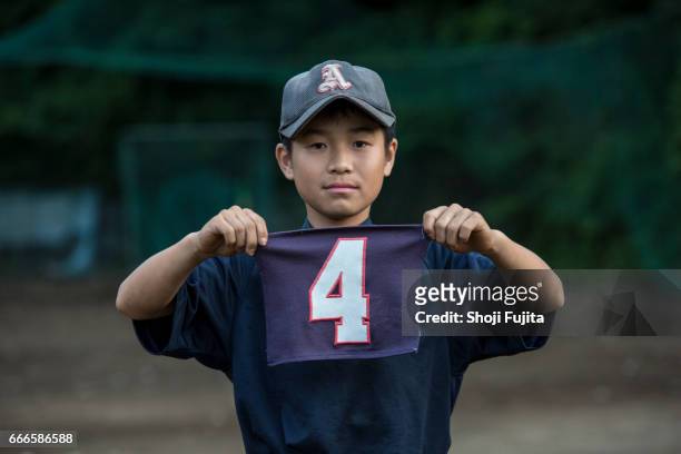 youth baseball players, uniform number - quarta feira foto e immagini stock
