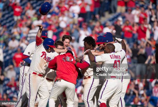 The Philadelphia Phillies celebrate after a walk off single hit by Cesar Hernandez of the Philadelphia Phillies in the bottom of the ninth inning...