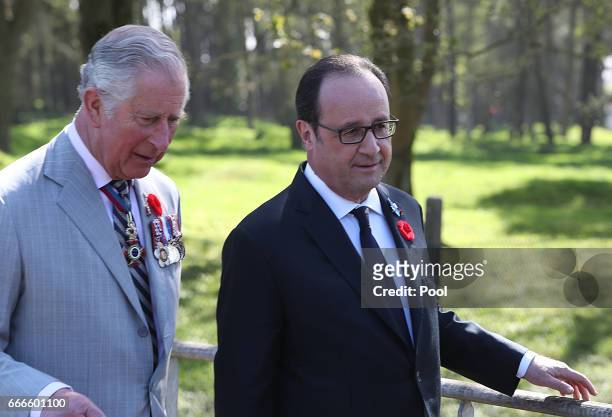 Charles, Prince of Wales and French President Francois Hollande walk during 100th year anniversary of The Battle Of Vimy Ridge on April 9, 2017 in...