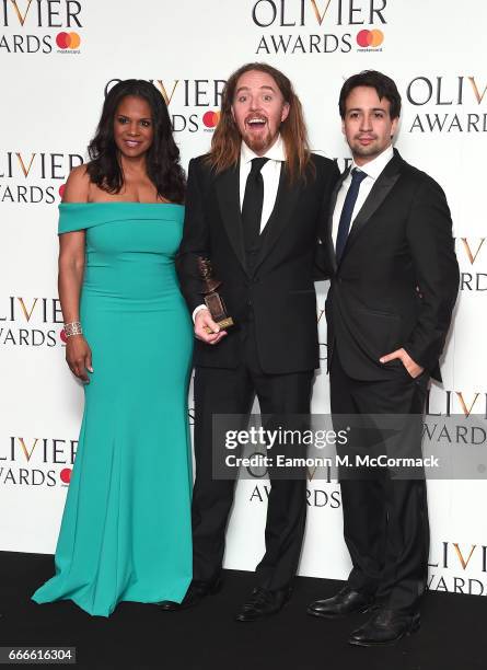 Audra McDonald, Tim Minchin, accepting the Best New Musical award for 'Groundhog Day', and Lin-Manuel Miranda pose in the winners room at The Olivier...