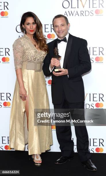 Preeya Kalidas with Mark Wigglesworth and his award for Outstanding Achievement in Opera for Don Giovanni and Lulu in the winners room at The Olivier...
