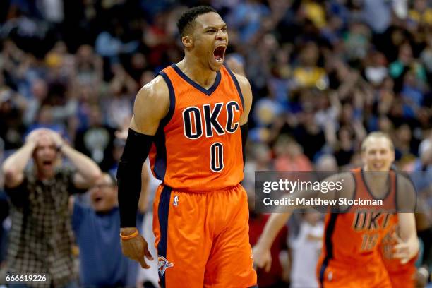 Russell Westbrook of the Oklahoma City Thunder celebrates after scoring a game-winning, three-point shot at the buzzer against the Denver Nuggets at...