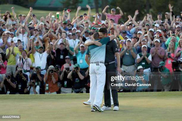 Justin Rose of England congratulates Sergio Garcia of Spain after Garcia won on the first playoff hole during the final round of the 2017 Masters...