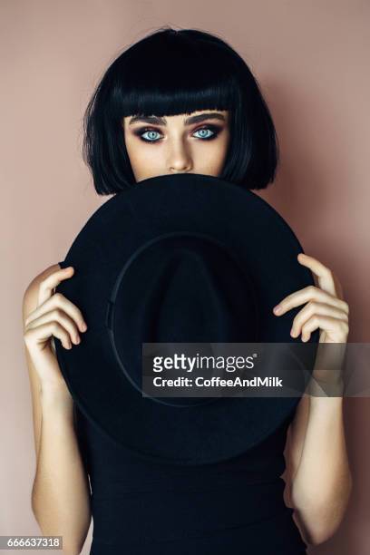 beautiful girl wearing hat - close up of beautiful young blonde woman with black hat stock pictures, royalty-free photos & images