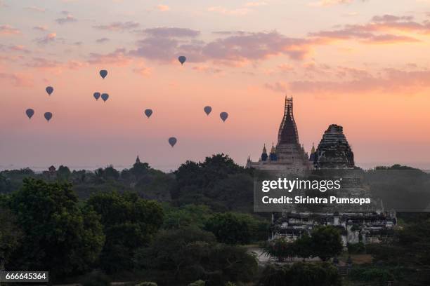 hot-air balloons flying over ananda temple at early morning, bagan, myanmar - bagan temples damaged in myanmar earthquake stock pictures, royalty-free photos & images