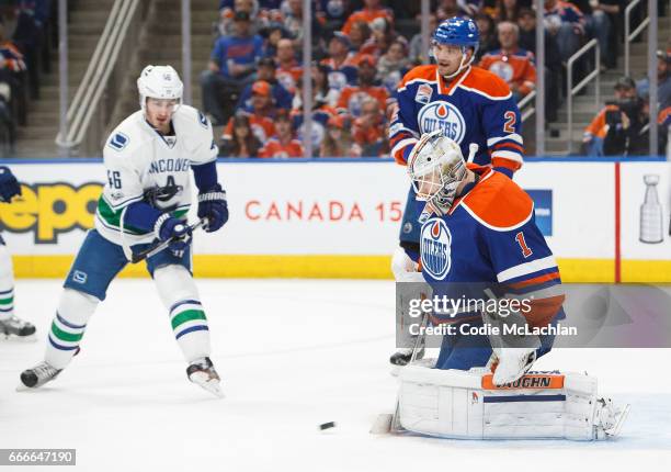 Goalie Laurent Brossoit of the Edmonton Oilers makes a save against Jayson Megna of the Vancouver Canucks in the first period on April 9, 2017 at...