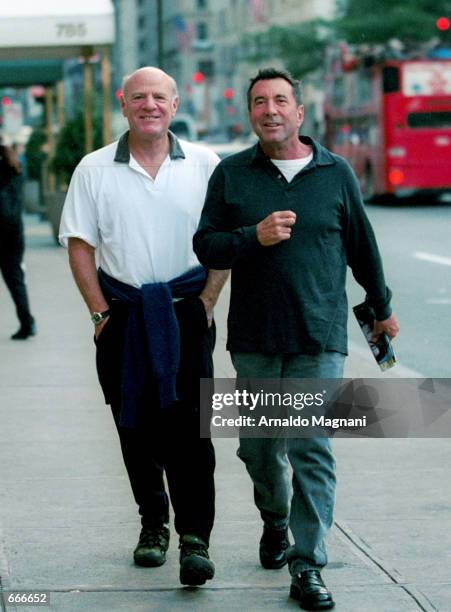 Network CEO Barry Diller and talent manager Sandy Gallin walk along Fifth Avenue October 2, 2000 in New York City.