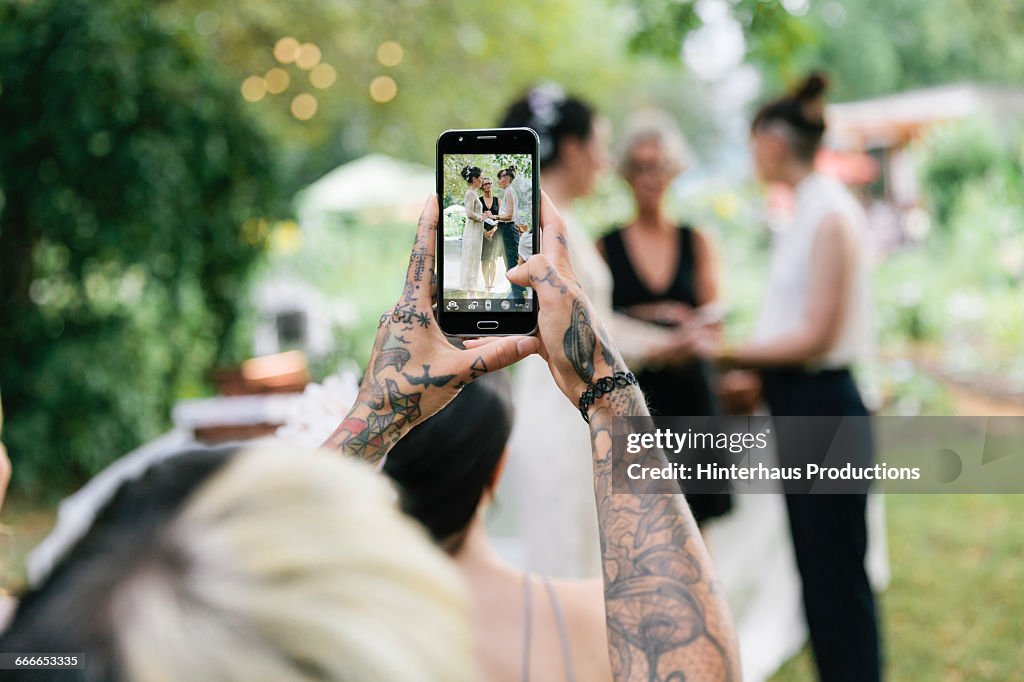 Woman taking photo at Wedding