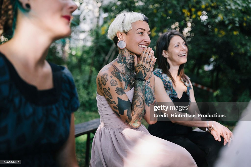 Wedding guest looks on as friends get married