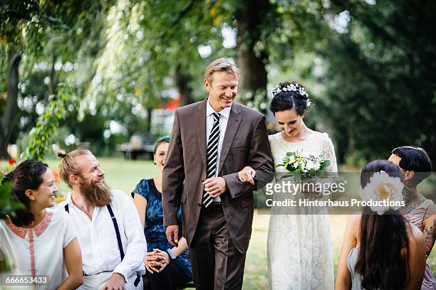 father guiding his daughter to the altar - europe bride stock pictures, royalty-free photos & images