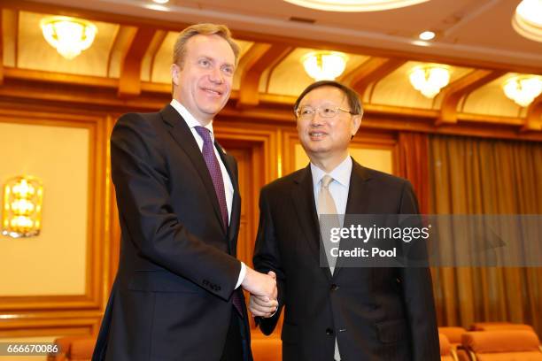 Norway Foreign Minister Borge Brende shakes hands with Chinese State Councilor Yang Jiechi ahead of a meeting in Zhongnanhai Leadership Compound on...