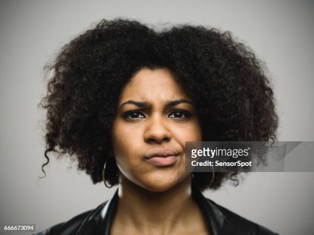 close-up portrait of displeased young afro american woman - angry black woman stock pictures, royalty-free photos & images
