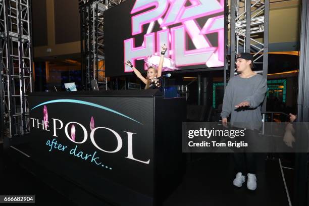 Paris Hilton and boyfriend Chris Zylka are on stage at The Pool After Dark at Harrah's Resort on Saturday April 8, 2017 in Atlantic City, New Jersey