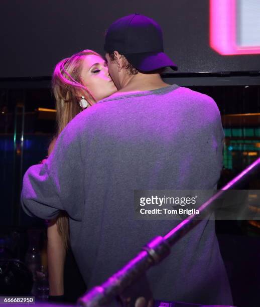 Paris Hilton and boyfriend Chris Zylka are on stage at The Pool After Dark at Harrah's Resort on Saturday April 8, 2017 in Atlantic City, New Jersey