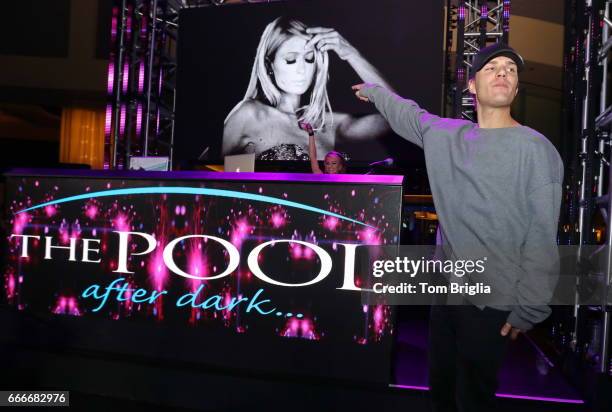 Paris Hilton and boyfriend Chris Zylka are on stage at The Pool After Dark at Harrah's Resort on Saturday April 8, 2017 in Atlantic City, New Jersey