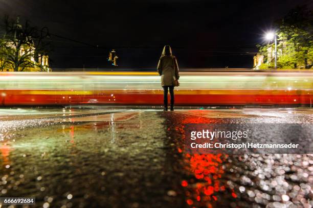 waiting on street - long exposure train stock pictures, royalty-free photos & images